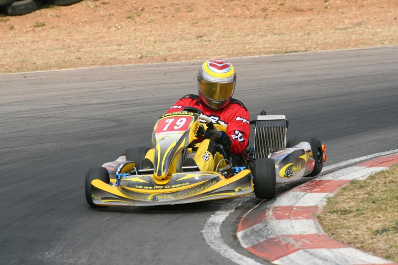 the race driver is moving his kart with two hands