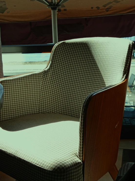 a chair is made with a cushion and seat cushion