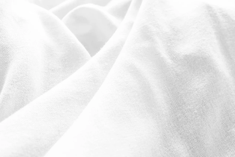 a closeup of a white t - shirt with a gray background