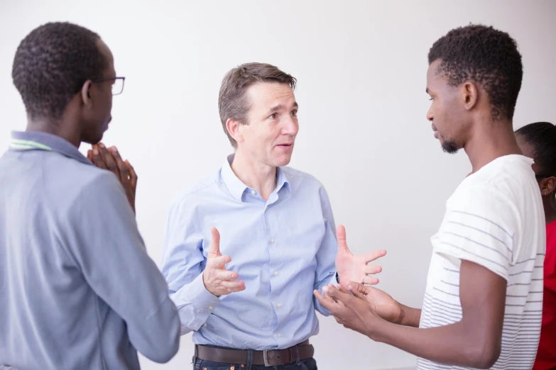 three african american men discussing soing and having fun