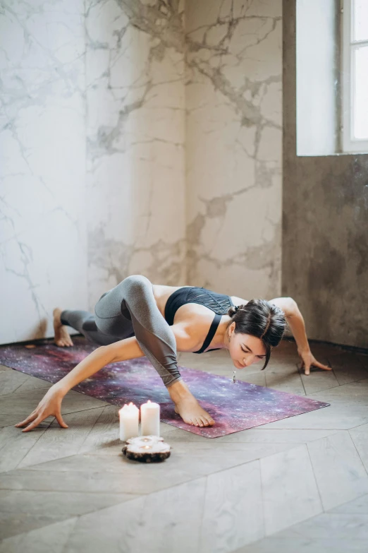 a girl wearing sportswear stretching and doing yoga