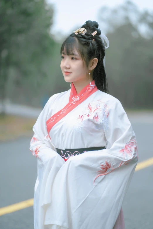 a woman is dressed in traditional chinese costume