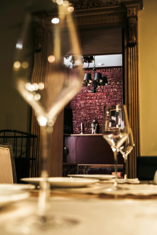 a table is set with several empty wine glasses