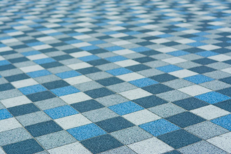 closeup of blue and white checkered tile on the ground