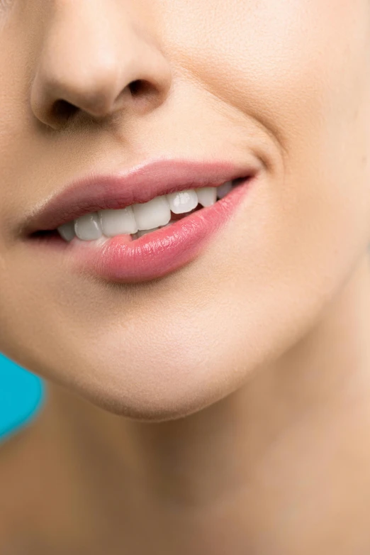 a young lady with her teeth missing showing the tip of the lower lip