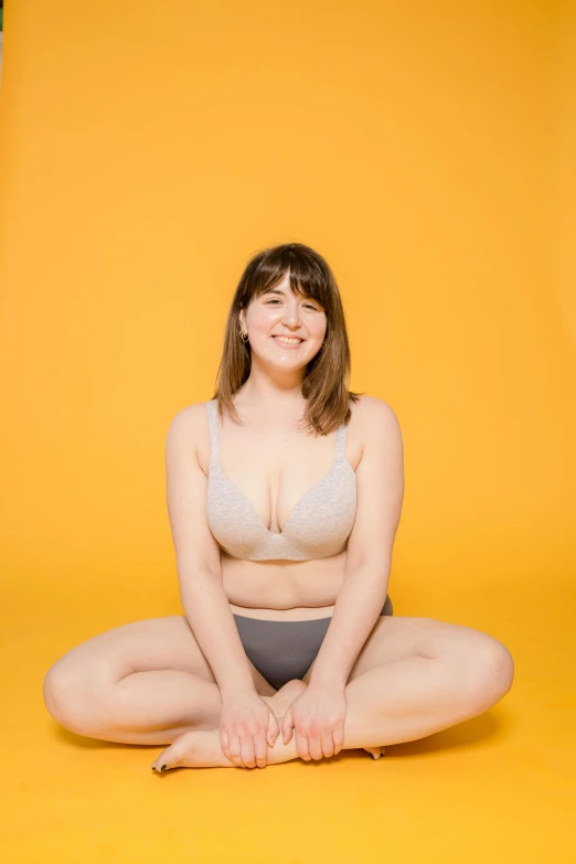 a beautiful young woman wearing a bikini and posing