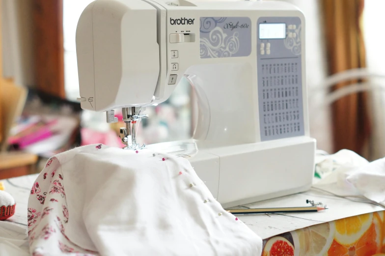 a sewing machine sitting on top of a table