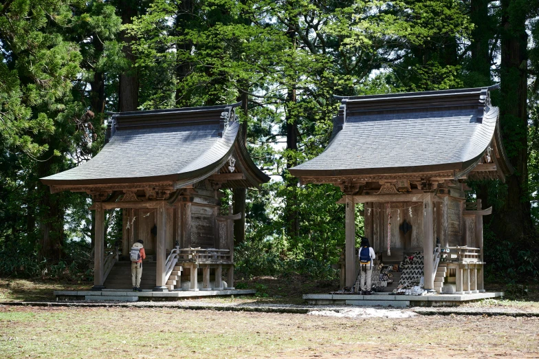 two asian style pavilions on one side and one is in the other