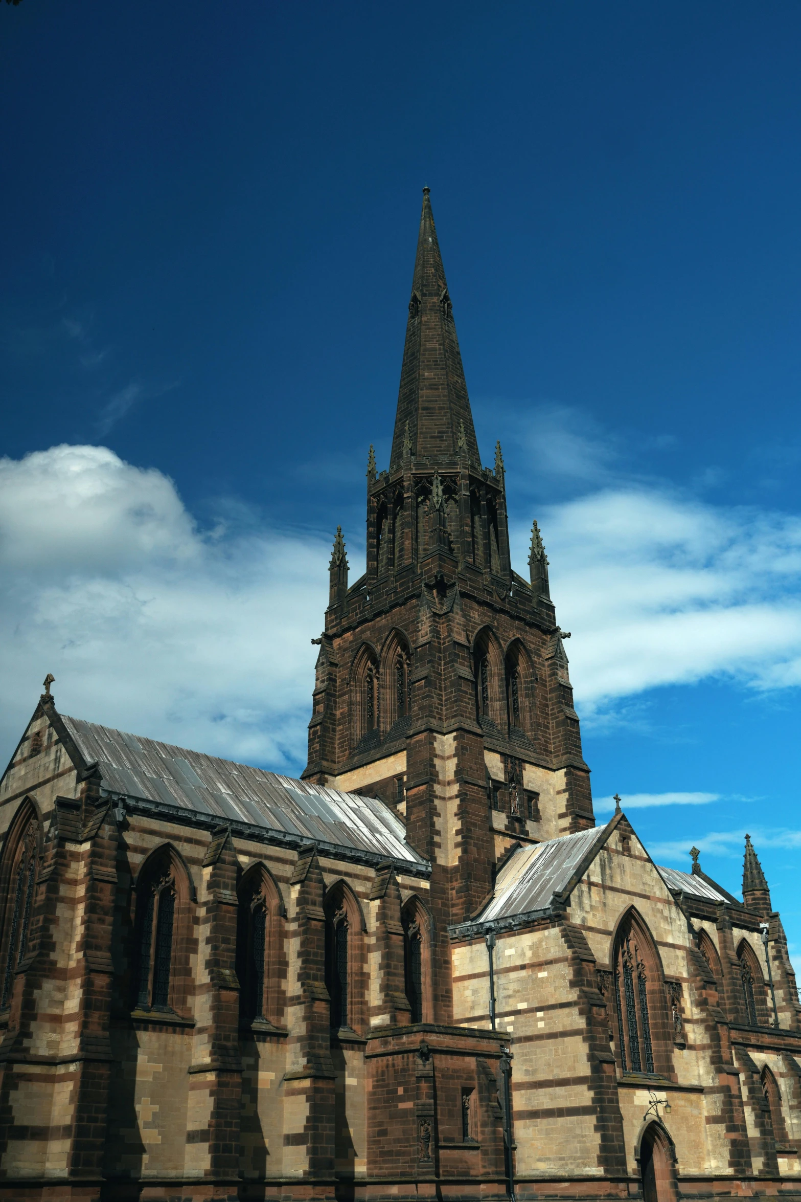 the view of an old cathedral with a sky background