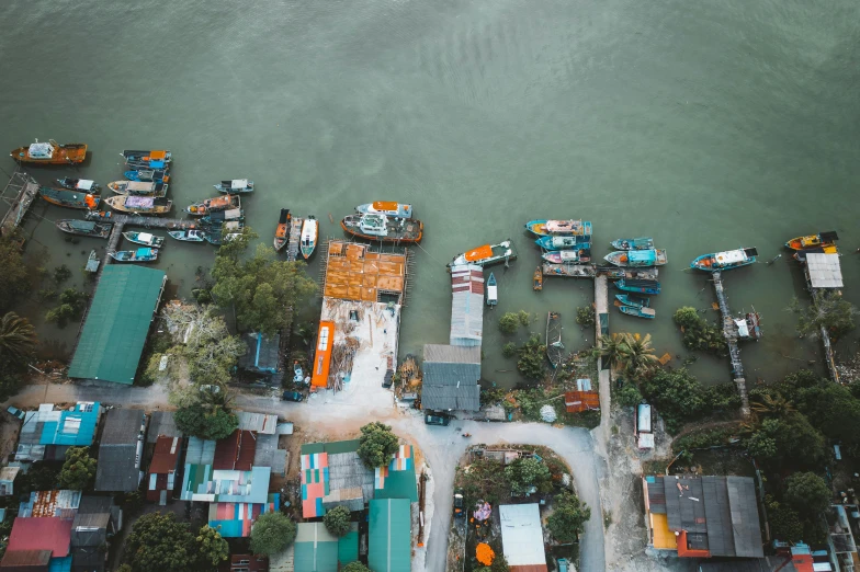 the sea side of an island with lots of boats parked on top