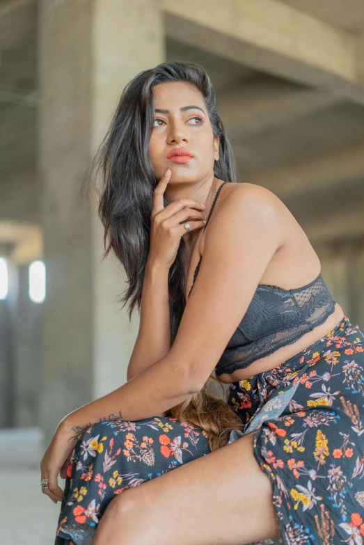 a woman sitting down while looking into the distance