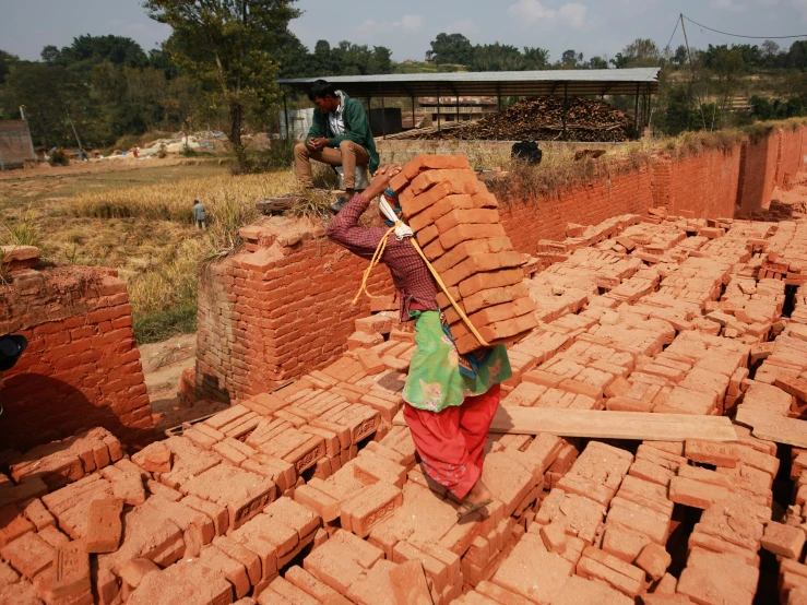 some people who are building brick houses on the hill