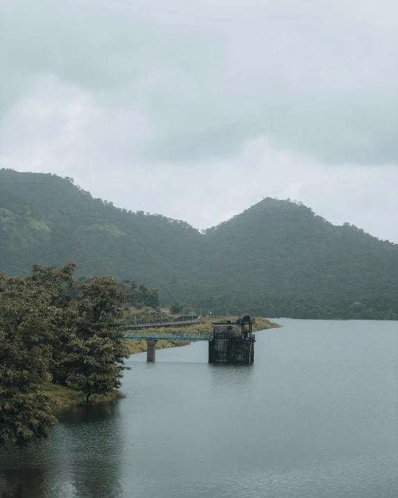 a couple of wooden posts in a large body of water