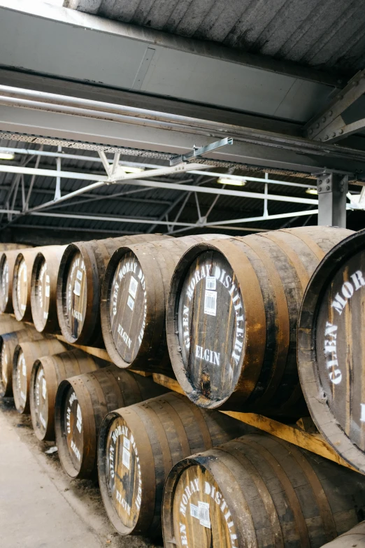 barrels are stacked up inside a barrel rack