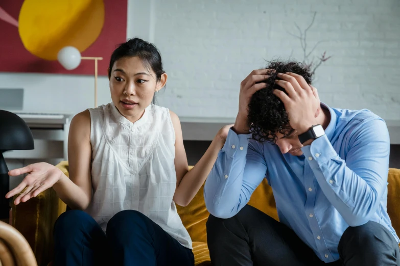 three people who are sitting together in a room