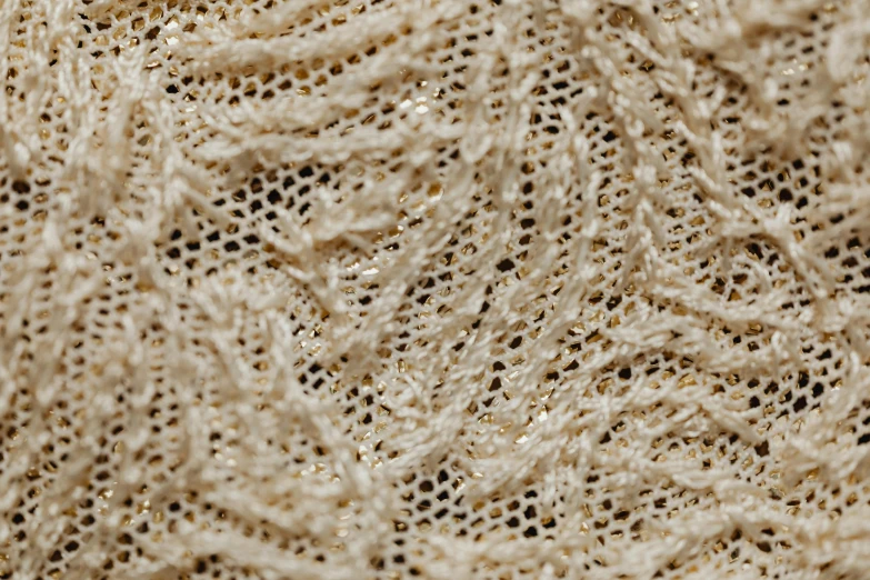 closeup of a piece of yarn with a holes in the middle