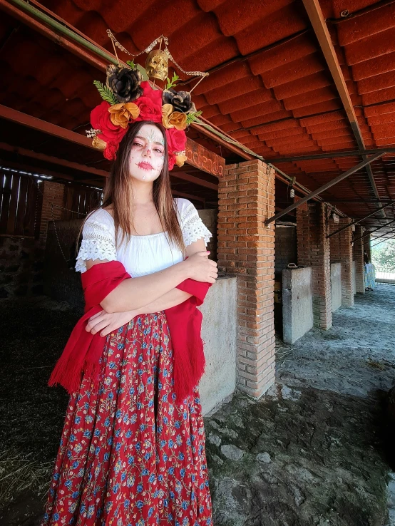 young lady in flowered hat and long dress outside