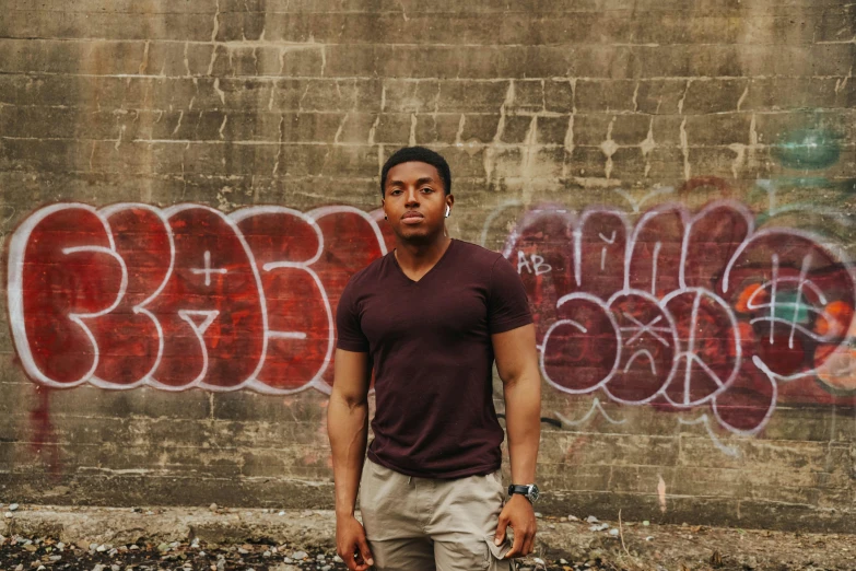 an image of a man with graffiti on the wall