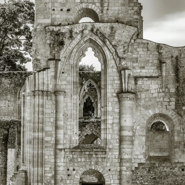 a very old brick church with a big arched window