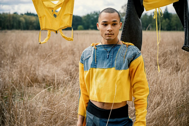 a man is posing for a picture in the field