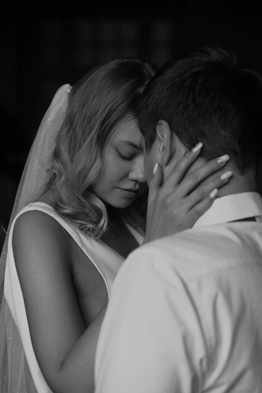 a couple emcing each other at their wedding