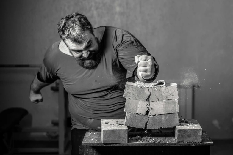 a man is throwing cement in a hammer