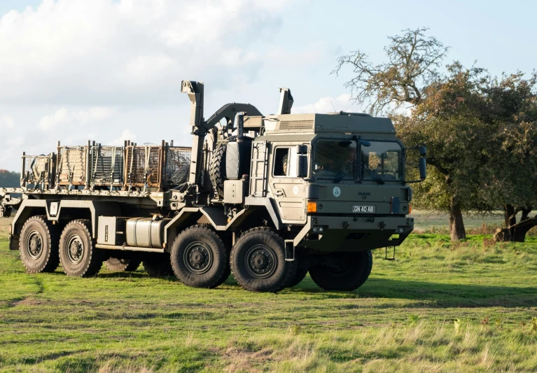 a truck is parked in the green field