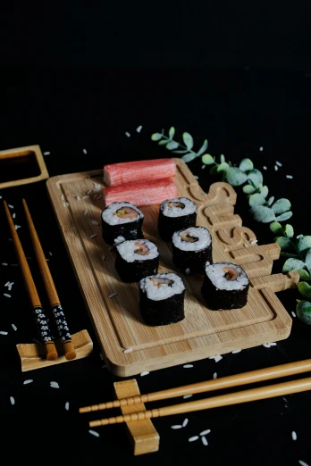 a bunch of sushi sitting on a  board