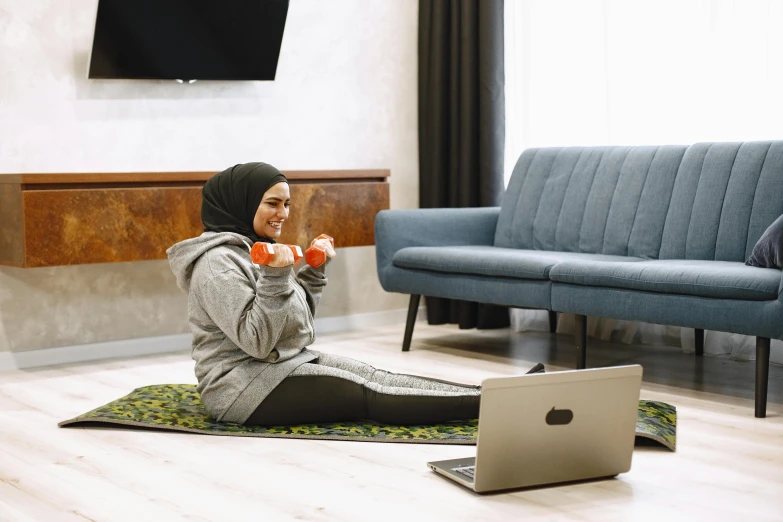 a woman sitting on the floor eating breakfast