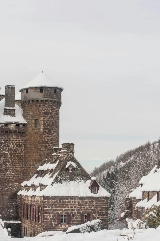 a tower with a clock on top that is covered in snow