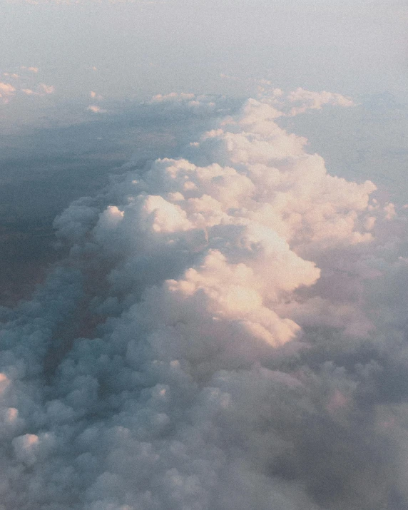 the view out of an airplane window is above the clouds