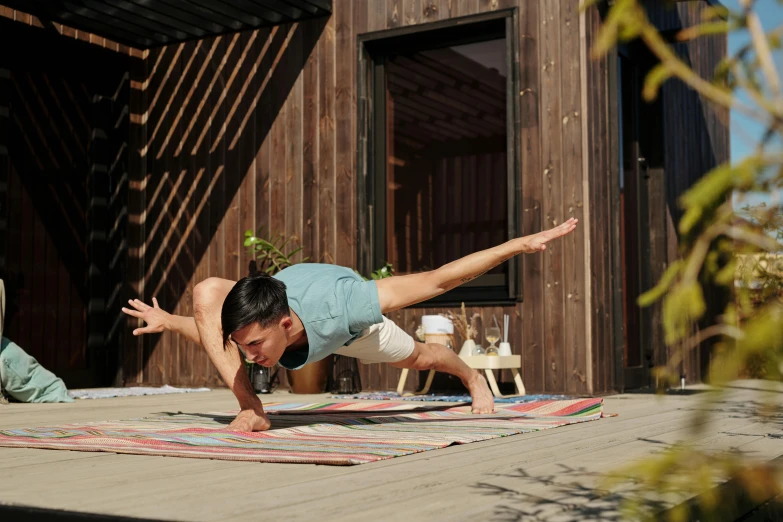 a man in a plank position doing a hand - h