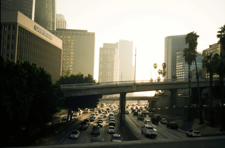 the view of a busy freeway in a city from the bridge