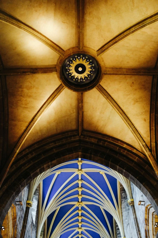 the interior of a church with a painted ceiling and an ornate clock