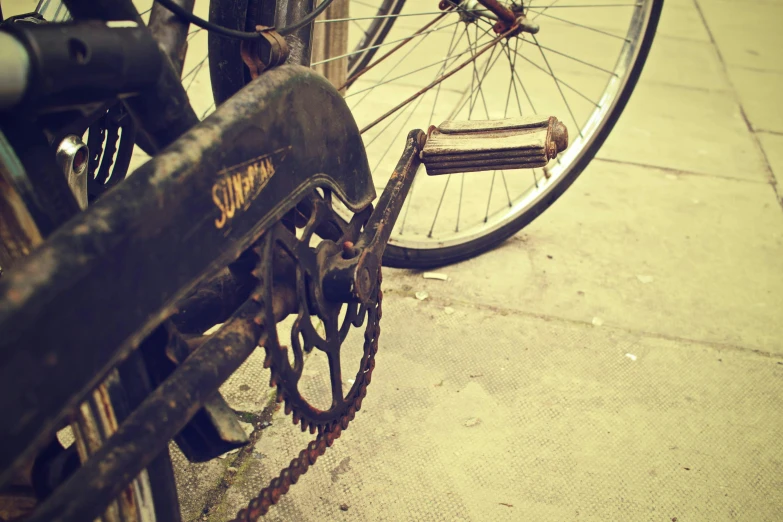 a bike parked next to a bicycle on the sidewalk