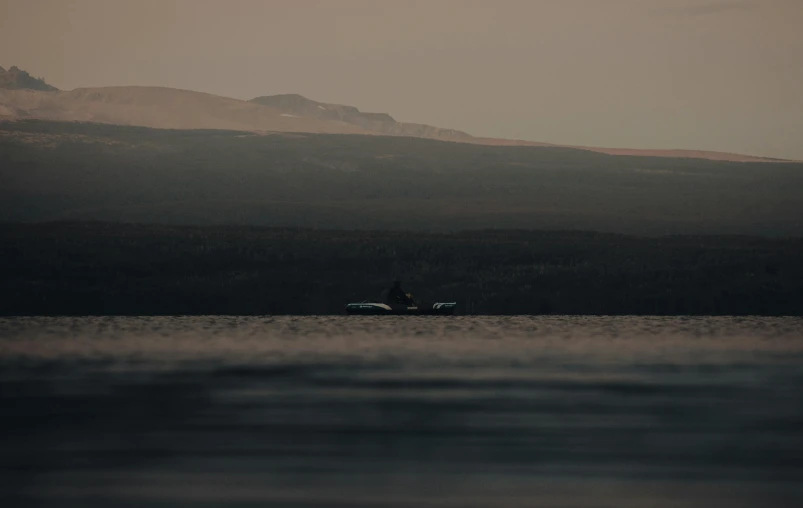 a boat floating on top of a lake