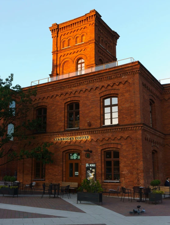 a building with a very tall tower with a clock on top