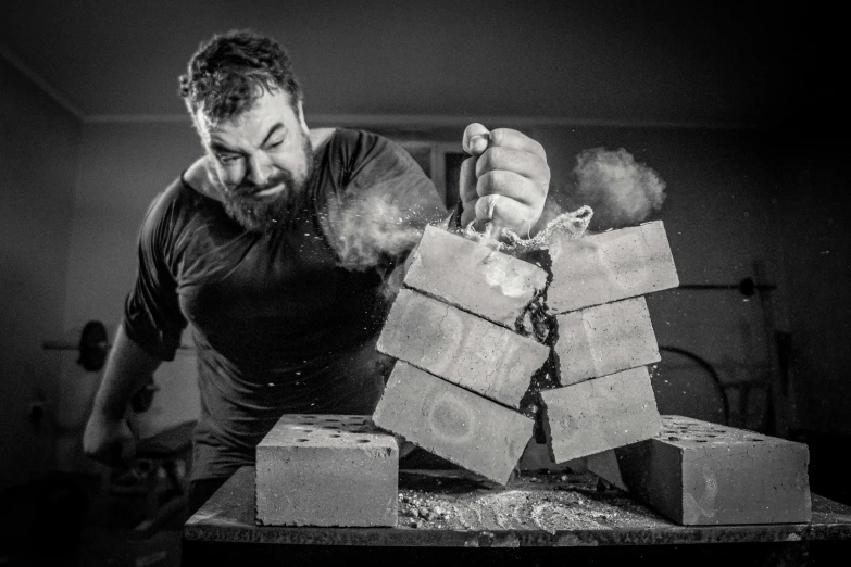 a man making a stack of legos from boxes