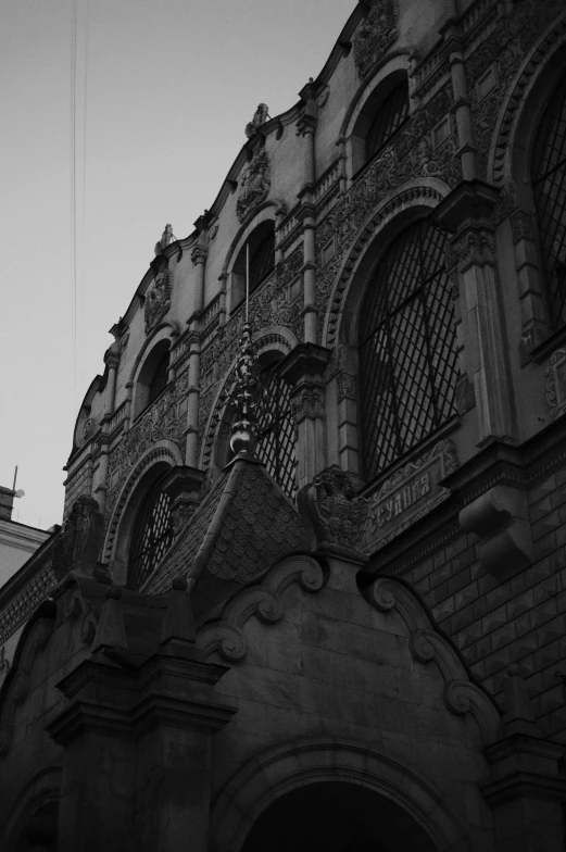 a black and white image of a very old building