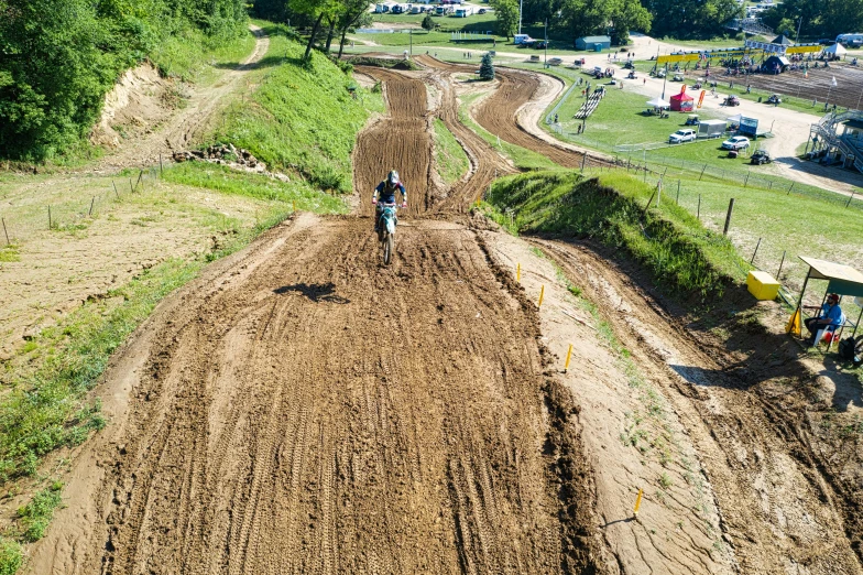 people walking down the dirt road