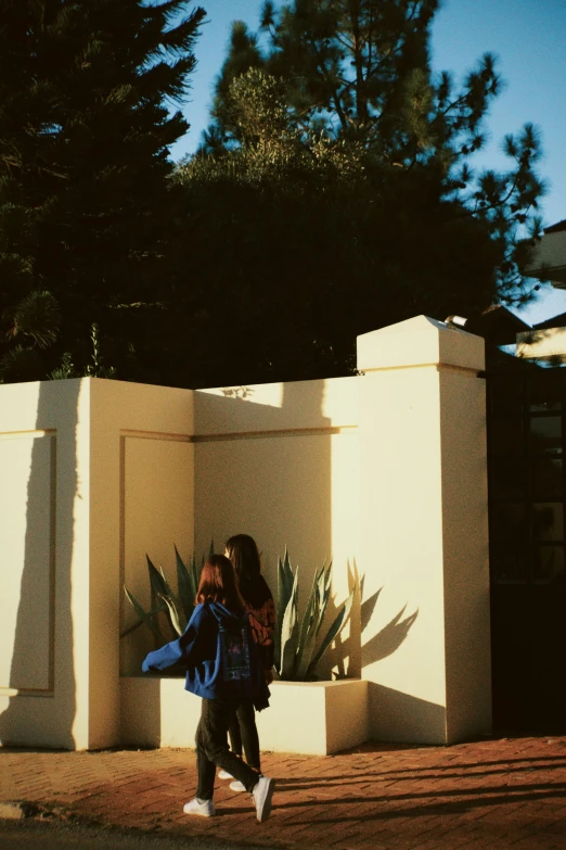 a young lady walking down the street with a handbag