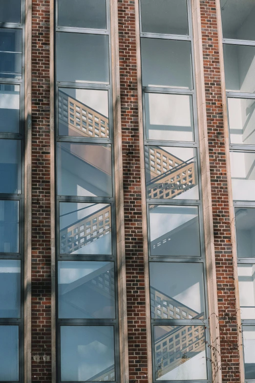 a close up of an open window with a stair case