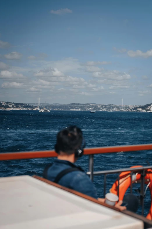 an orange boat is in the water on it's way