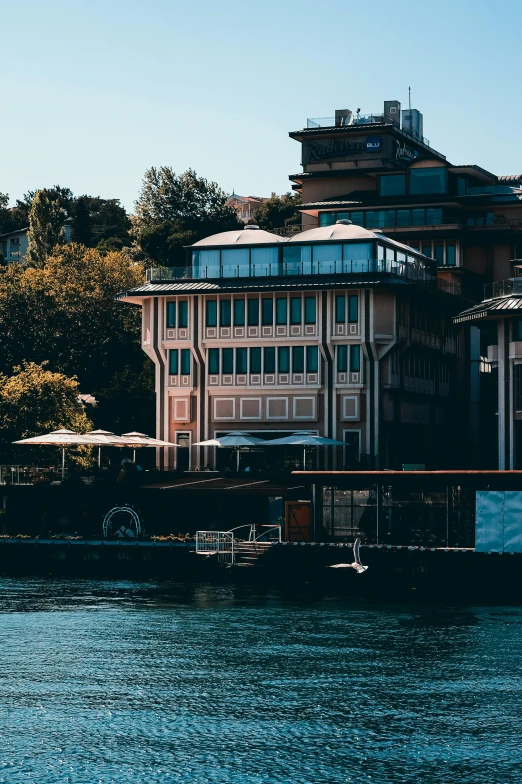 a view of a large building next to a body of water