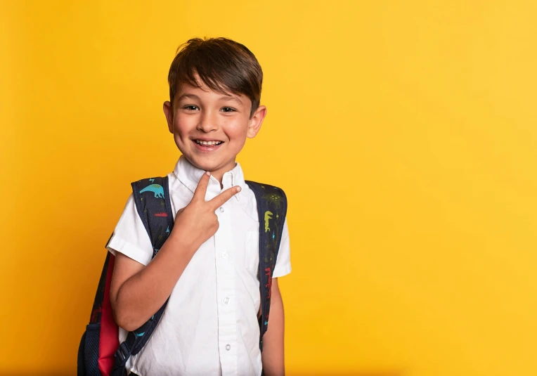  with white shirt, blue shorts and black backpack