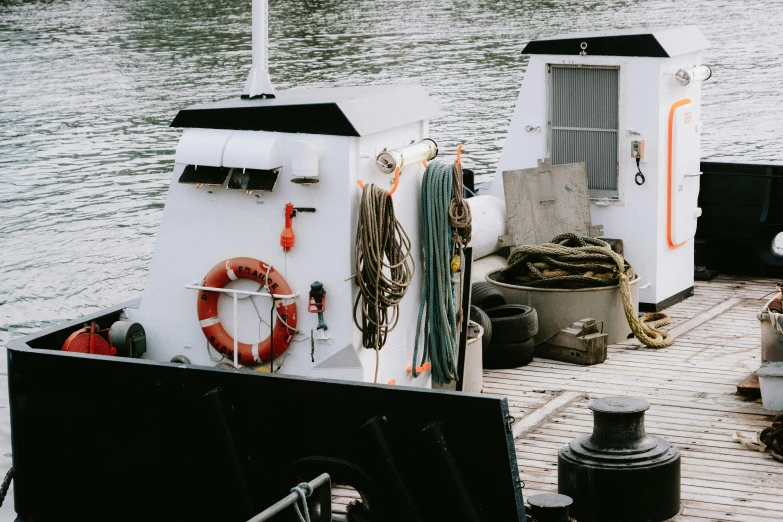 several different objects are on the deck of a boat