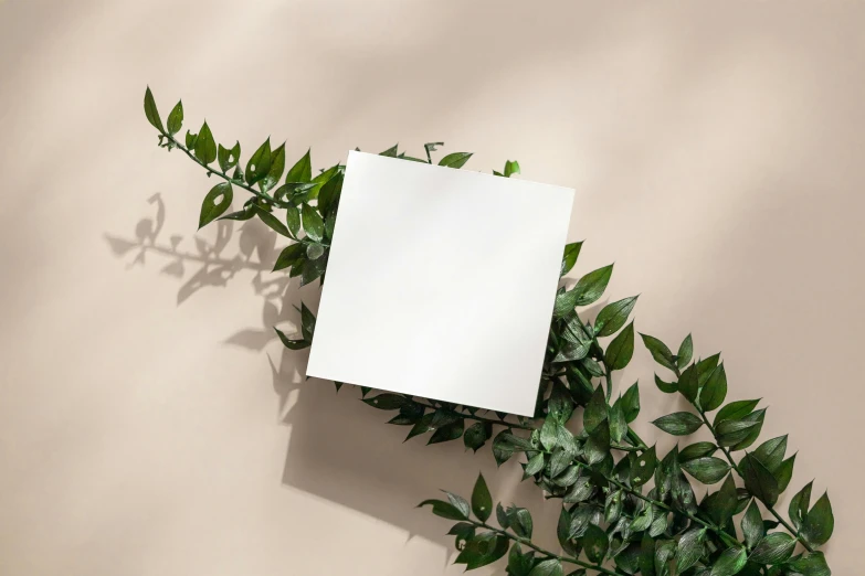 a blank note card sitting on top of a table