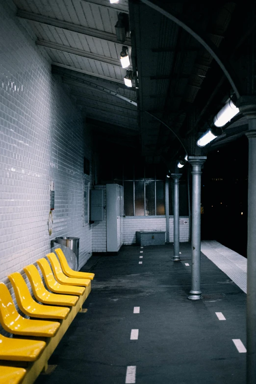 yellow chairs in the middle of a hallway