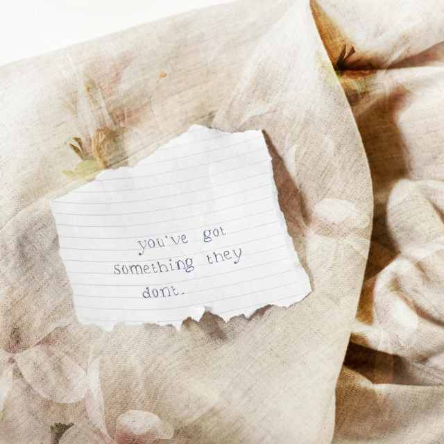 an note is written on a sheet of paper