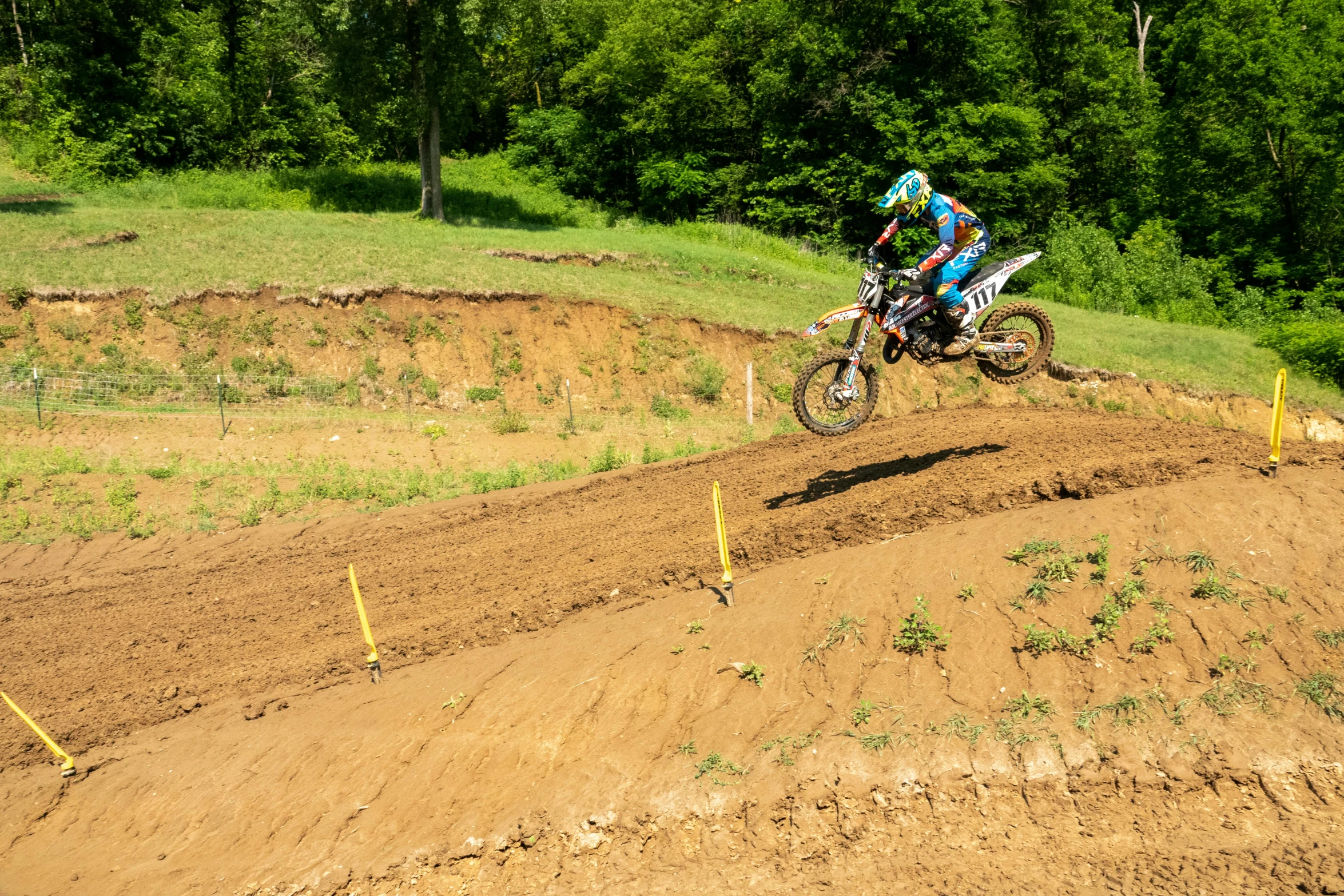 a person on a dirt bike does a jump